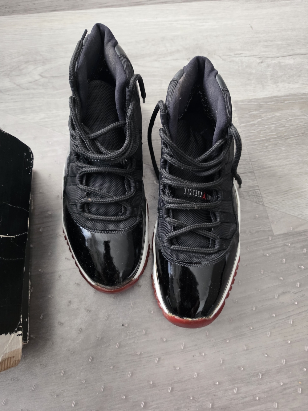 Air Jordan 11 Retro Black/Red Patent Leather Sneakers